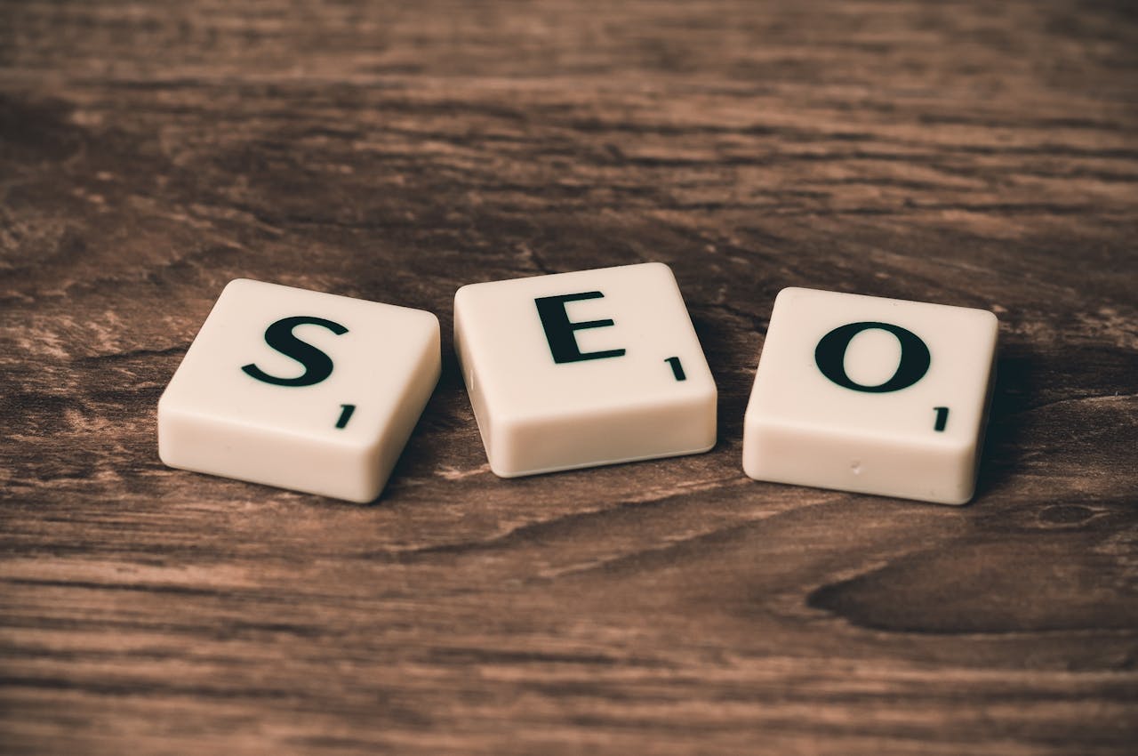 services-02 Scrabble tiles spelling SEO on a wooden surface. Ideal for digital marketing themes.